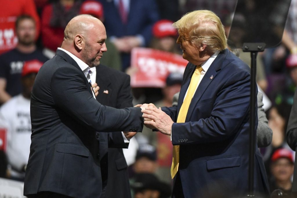 Ultimate Fighting Championship President Dana White greets President Donald Trump on stage during a Keep America Great rally on February 20, 2020 
Getty Images