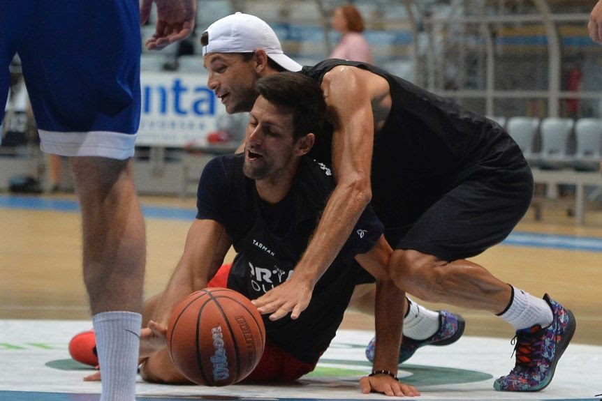 Grigor Dimitrov (top) played basketball against Novak Djokovic (bottom) as recently as last Thursday.(AP: Zvonko Kucelin)