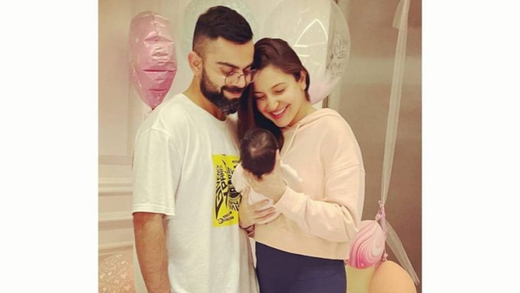 Virat Kohli and Anushka Sharma with their daughter