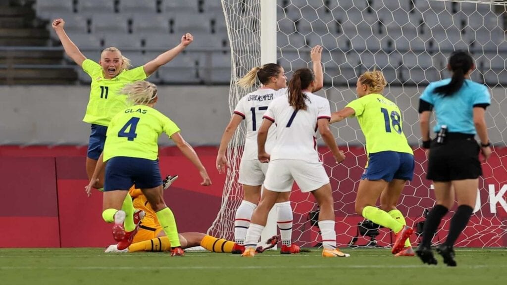 The Sweden players celebrate their goal against the US in the first match of the Olympics