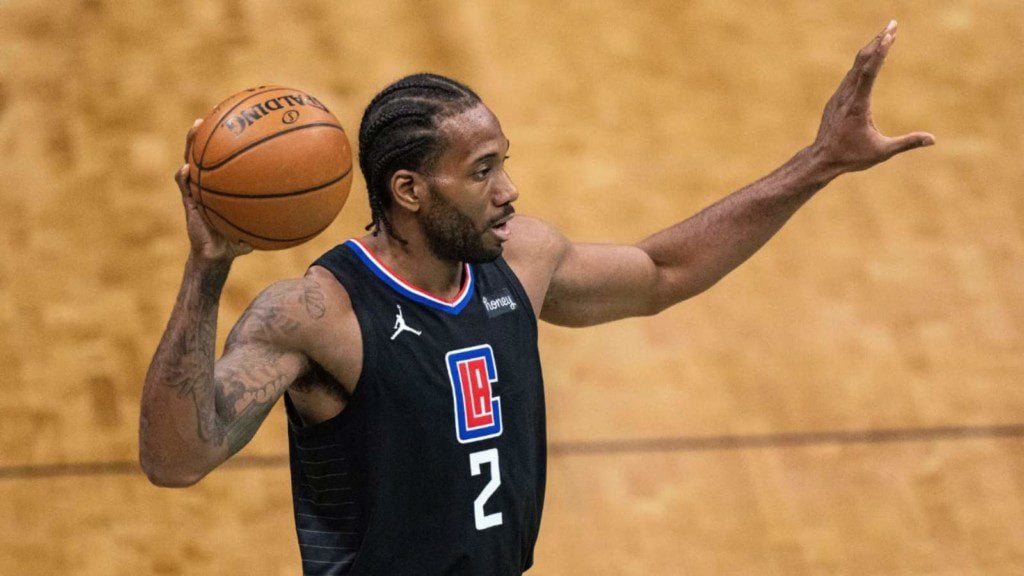 Kawhi Leonard peeling the Nike logo off his jersey for media day is one of  the great company men moves of all time, This is the Loop