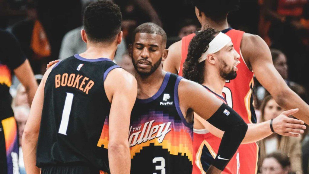 Devin Booker and Chris Paul in action against the Pelicans