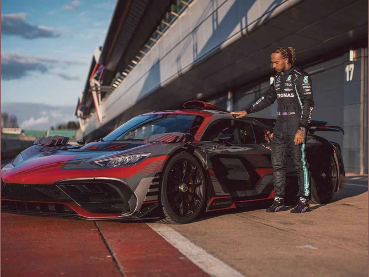 Lewis Hamilton looking at a Mercedes AMG Project One