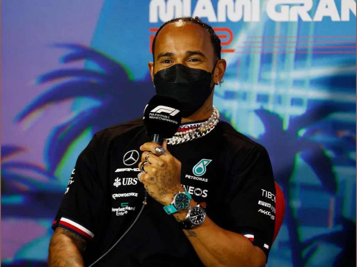 Lewis Hamilton wearing IWC watches at a press conference