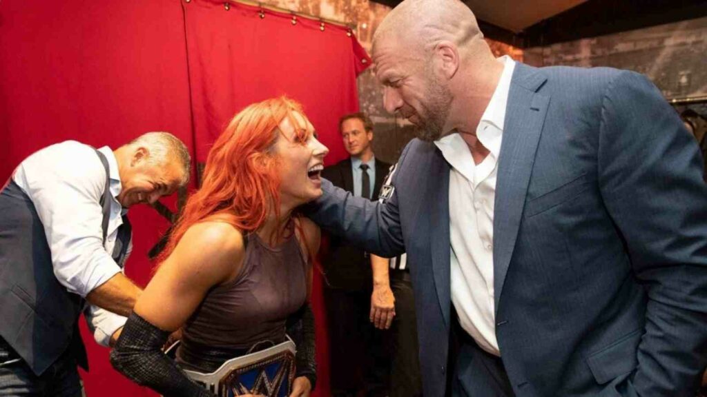 Triple H and Becky Lynch , when Becky won her first Championship in WWE