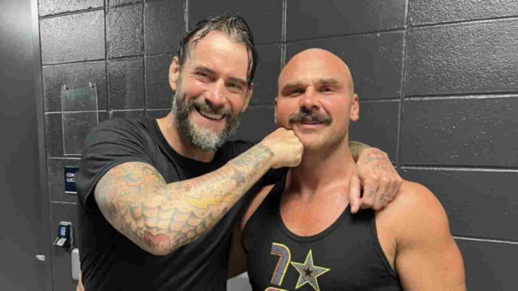 CM Punk with Dax Harwood