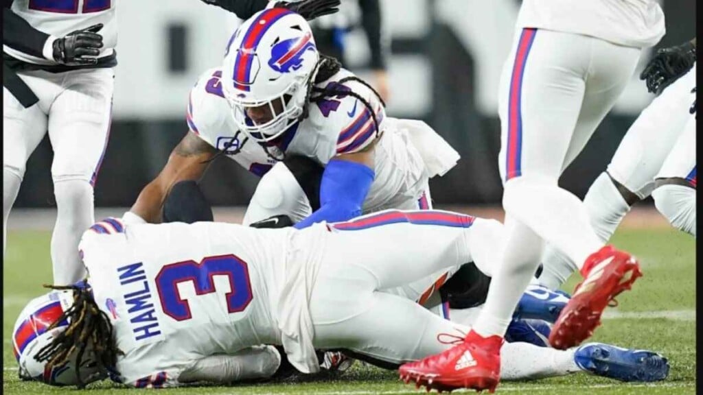 Damar Hamlin collapses to the ground after crashing into Tee Higgins (Image via New York Post)