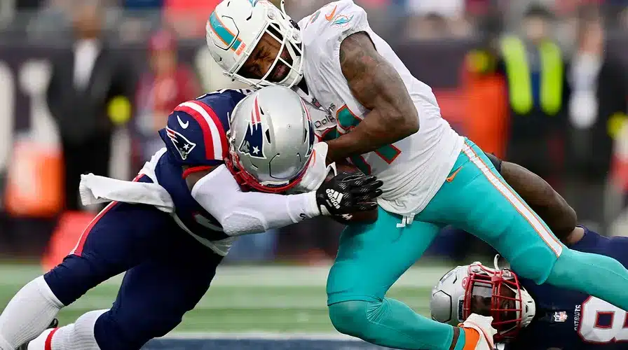 Patriots SCREWED by the refs after an awful blown call erases a fumble against the Dolphins in a must-win game