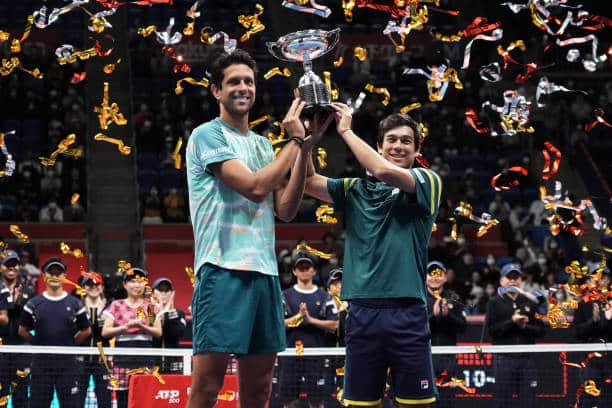  Mackenzie McDonald of the United States and Marcelo Melo of Brazil lifting the trophy at the Japan Open,2022. (via Getty Images)