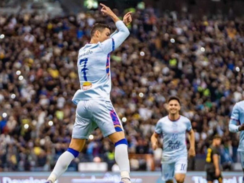 Cristiano Ronaldo celebrates after scoring for Al Nassr in a club friendly against PSG.