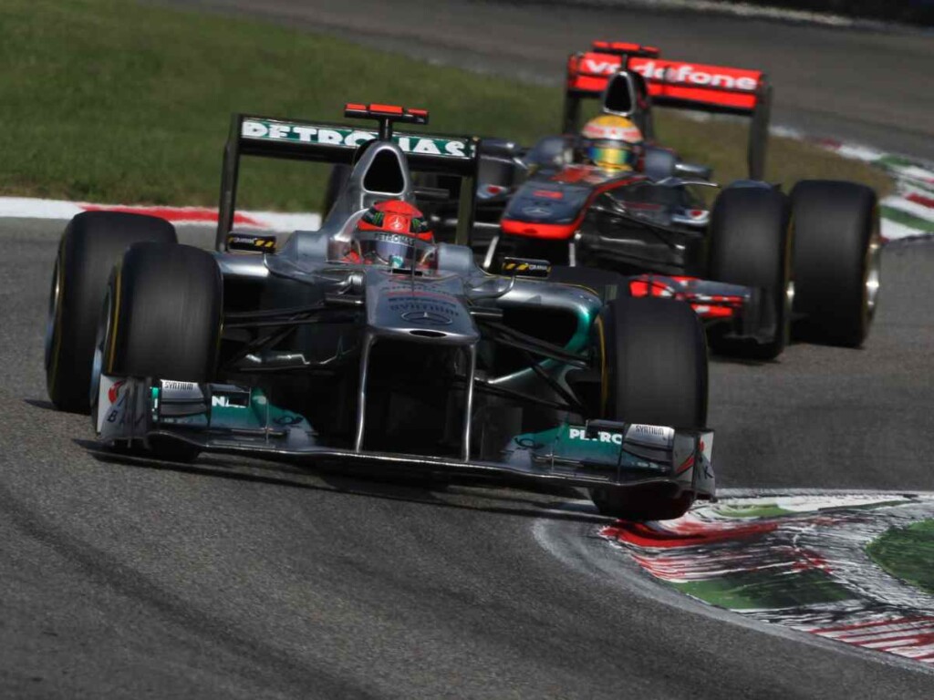 Michael Schumacher and Lewis Hamilton battling on track in Monza 2011