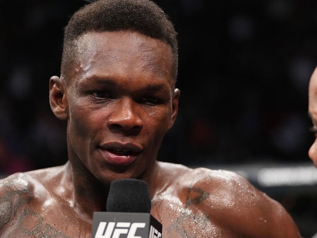 Watch: Israel Adesanya hilariously falls asleep out of boredom while watching Yan vs Dvalishvili 1 Israel Adesanya