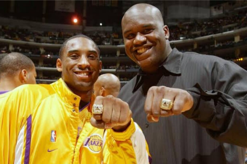 Shaquille O'Neal and Kobe Bryant with their rings