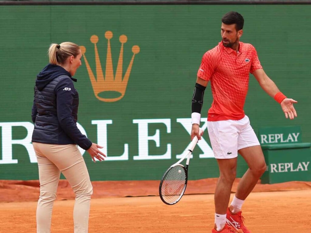 Novak Djokovic with chair umpire