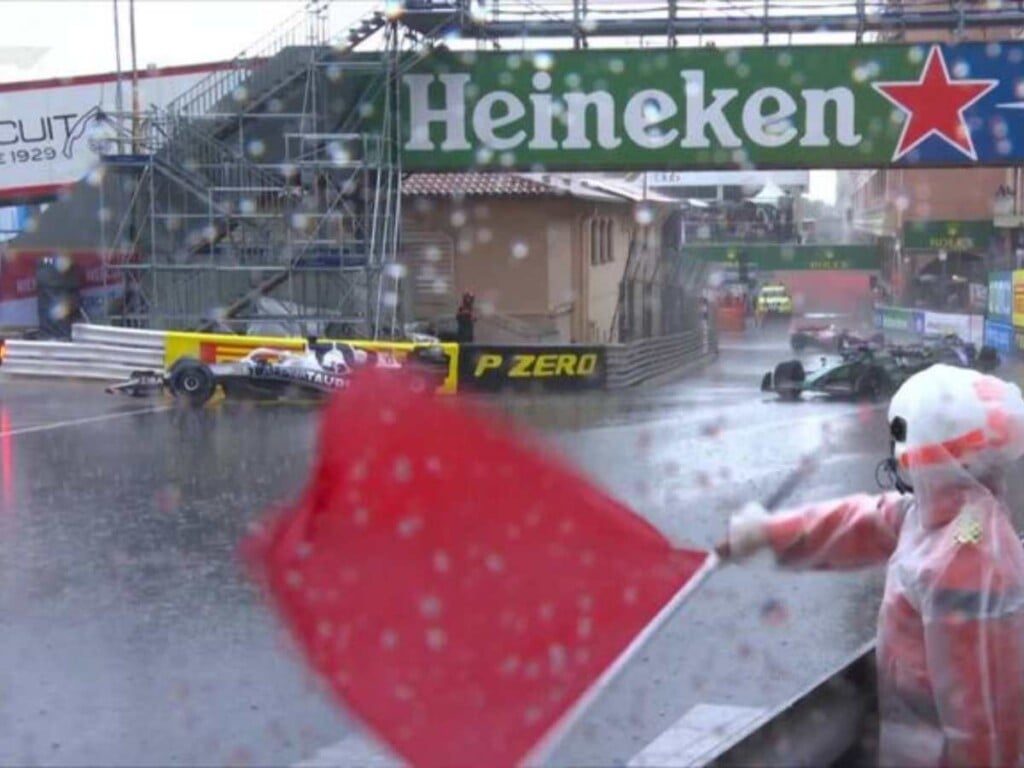 Red flag being waved for a rain soaked race