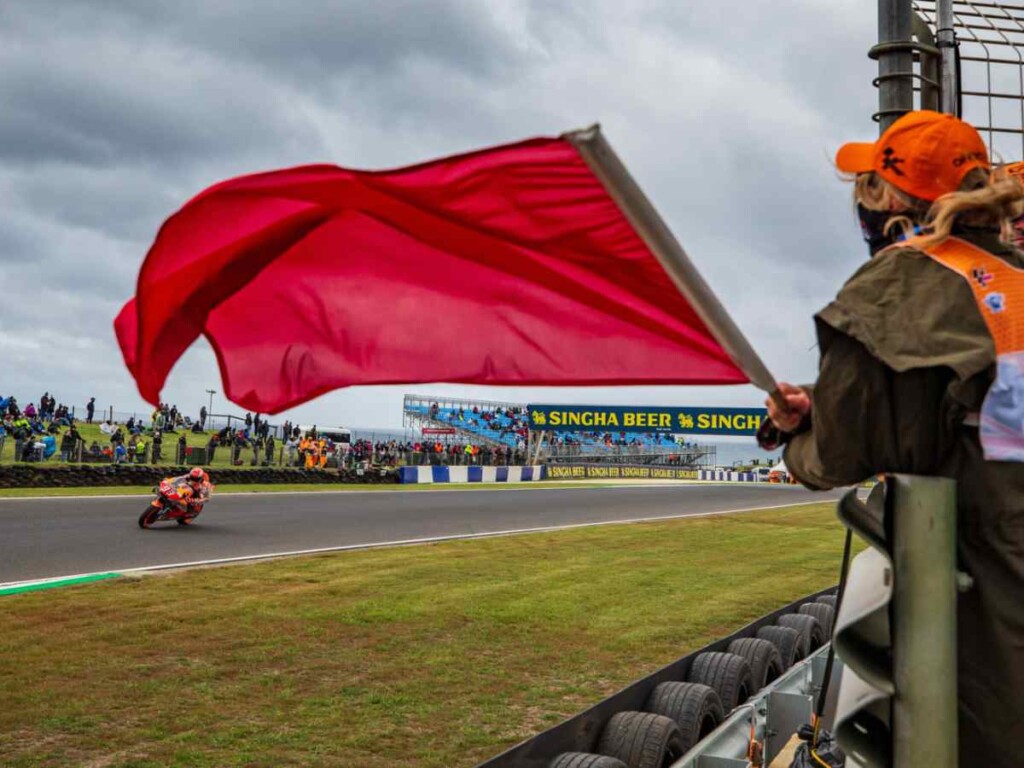 Red flag being waved in a MotoGP race