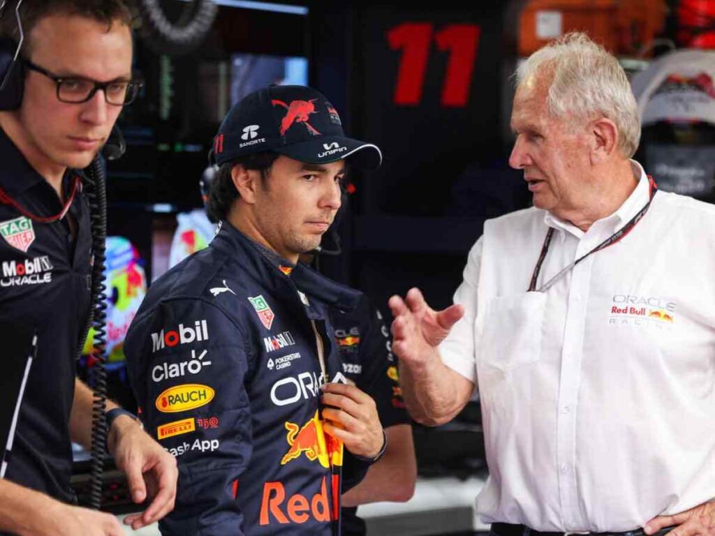 Red Bull's Sergio Perez (L) and Helmut Marko (R)