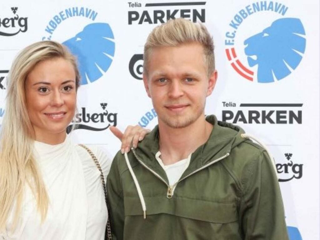 Kevin Magnussen, his wife at an event