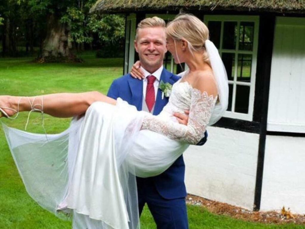 Kevin Magnussen and his wife at their marriage