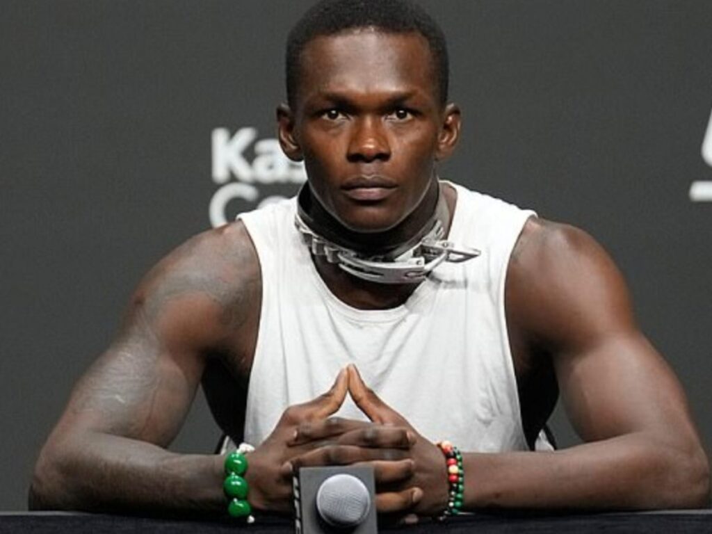 Israel Adesanya's on his unique-looking collar at UFC 287 press conference