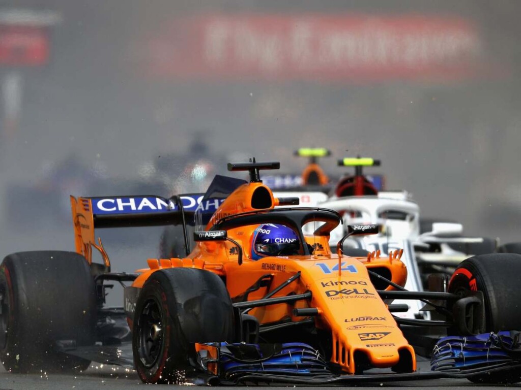 Fernando Alonso's McLaren suffering a double puncture