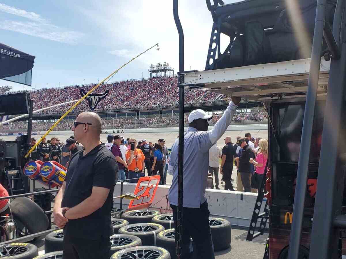 WATCH: “Bubba ran out of talent, Hire Dumb Drivers, Win Dumb Prizes”- Twitter reacts to a dejected Michael Jordan in the 23XI pit box after Bubba Wallace wreck