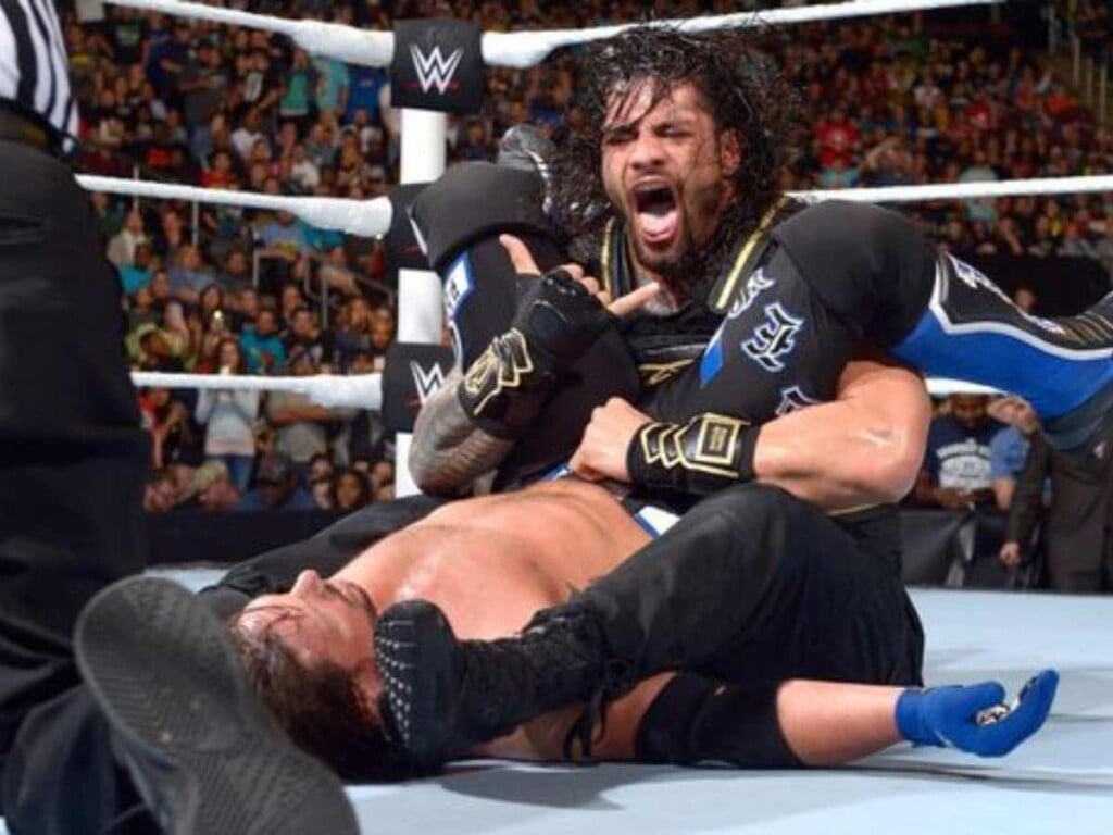 Roman Reigns hitting Sitdown Powerbomb