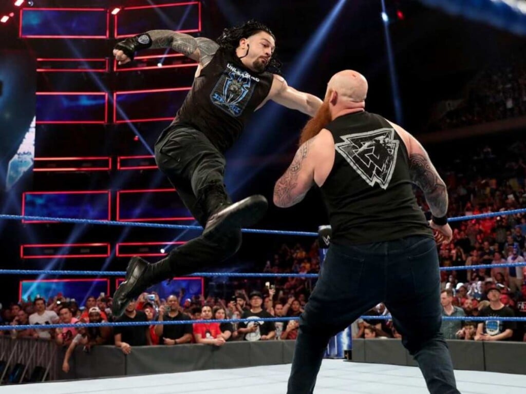 Roman Reigns hitting Superman Punch