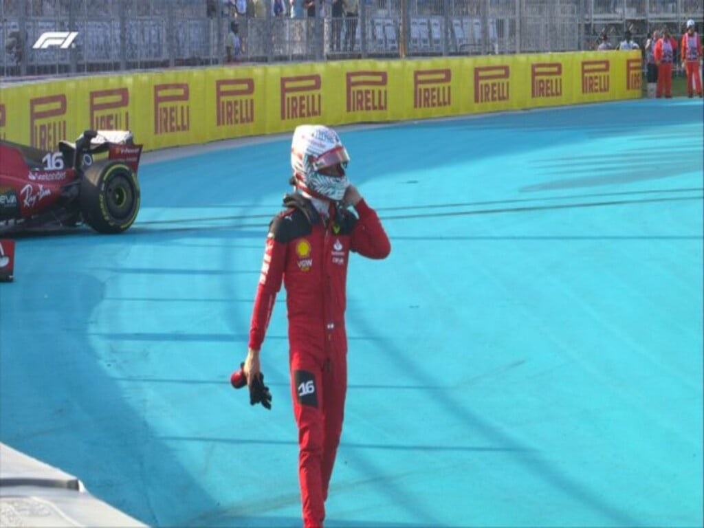 Charles Leclerc leaving his Ferrari via F1