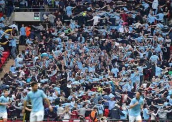 Manchester city fans seen doing the Poznan celebration at the 25th minute mark of the game against Chelsea