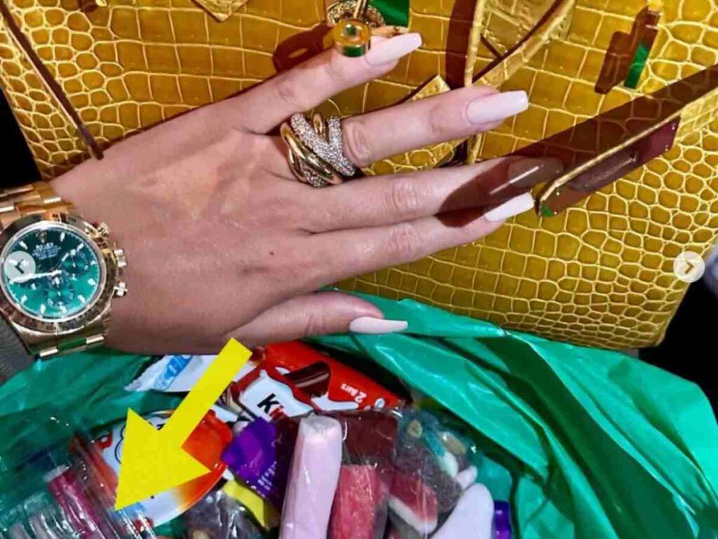 Georgina shares a snap of a bag full of treats presumeably for her kids and among the treats a box of fake nails are visible