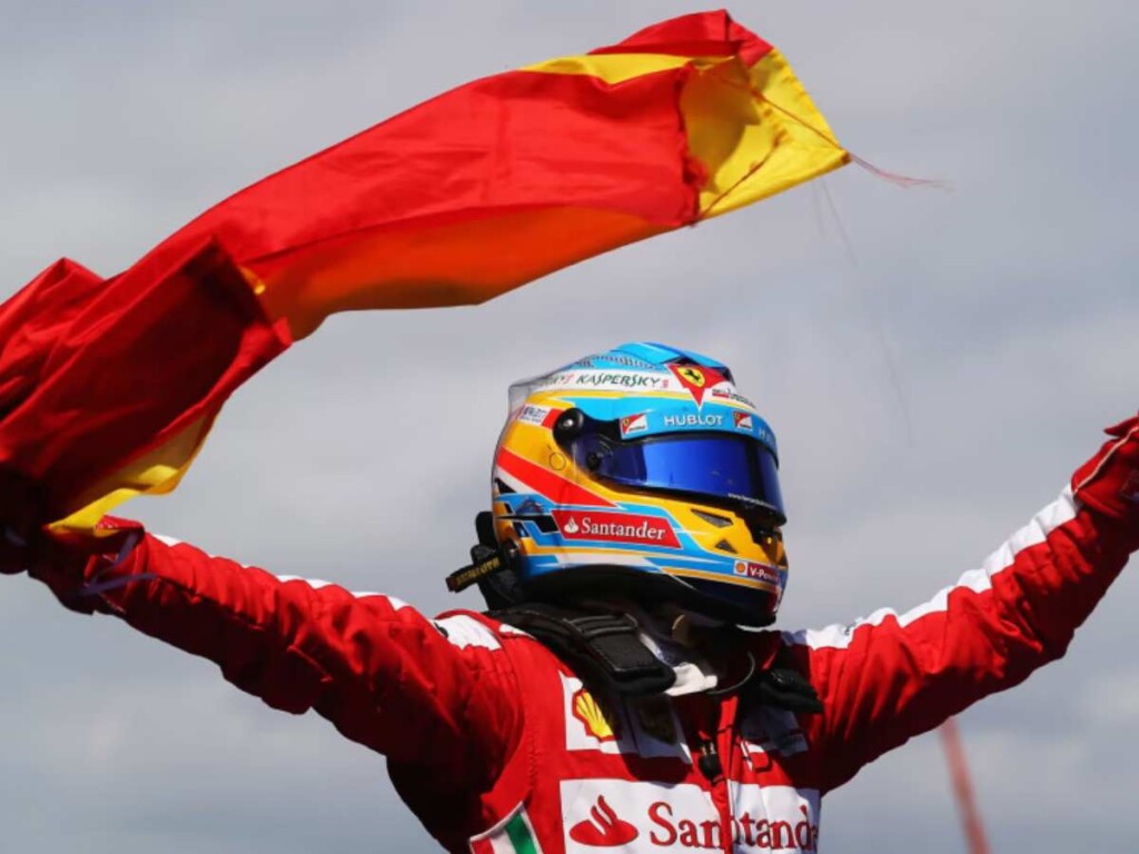 Fernando Alonso waves Spanish Flag