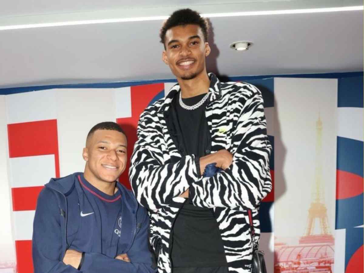 “Makes him look like a child”- Fans mock Kylian Mbappe after his meet-up with 7’3 Victor Wembanyama during NBA draft lottery