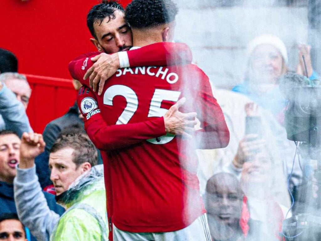 Jadon Sancho Bruno Fernandes hugging Manchester United