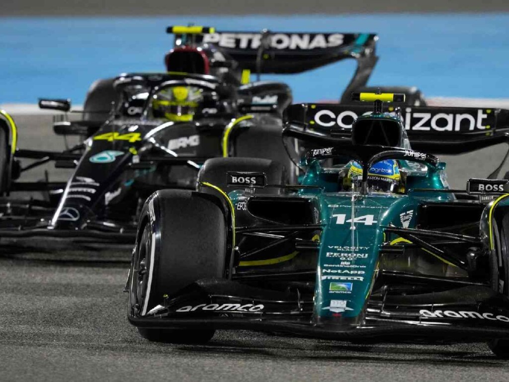 Fernando Alonso passes Lewis Hamilton's Mercedes at the Bahrain GP 