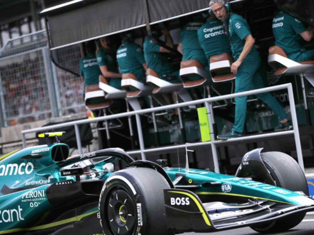 Aston Martin team boss, Mike Krack looks over at the 2023 car