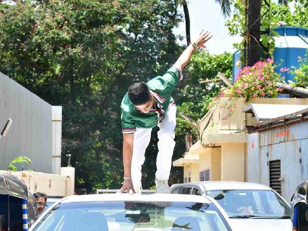 Shubman Gill poses as Spider-Man on top of a car