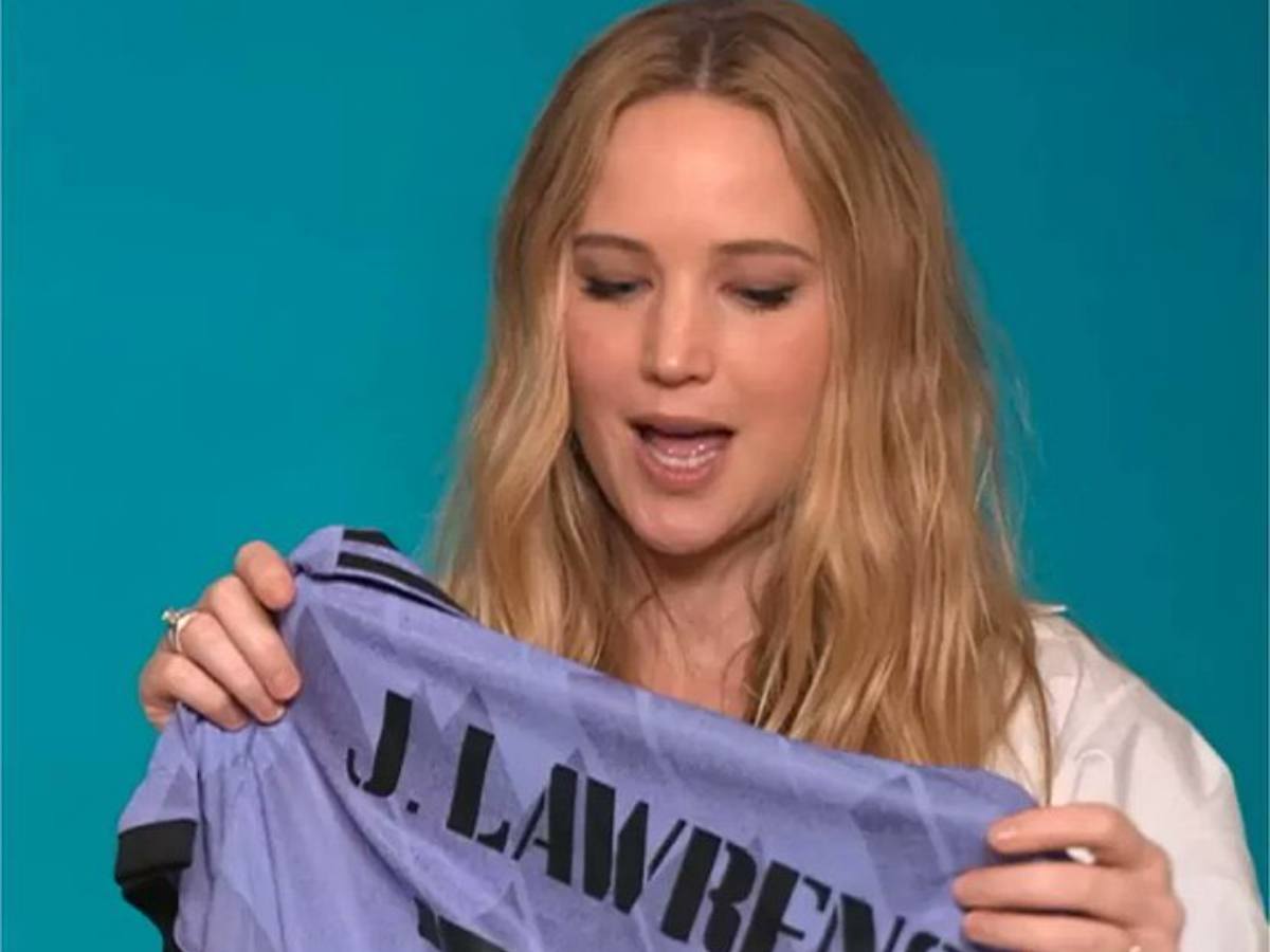 Real Madrid gifts Hollywood actress Jennifer Lawrence a customized number 10 purple club shirt