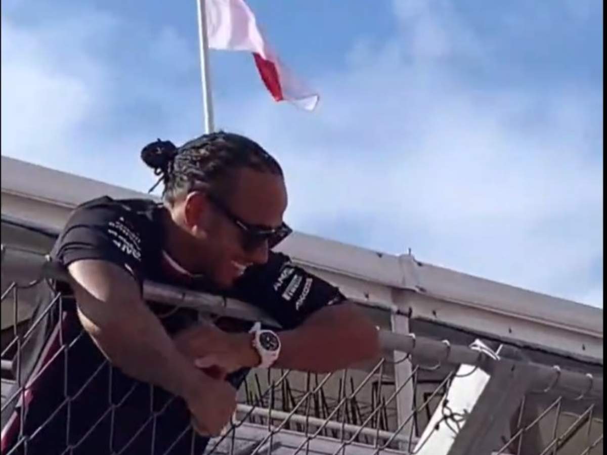 WATCH: “He is a Cult Leader”- Lewis Hamilton celebrates Spanish GP P2 with fans by climbing pit wall fence, F1 Twitter reacts