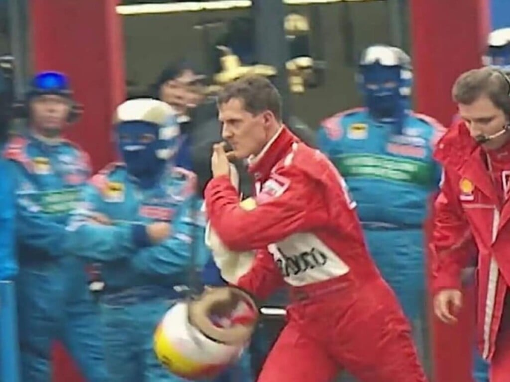 Michael Schumacher on his way to confront David Coulthard (Credits The Guardian)