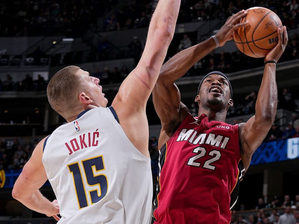 Nikola Jokic guards Jimmy Butler (Image via Bart Young/NBAE via Getty Images)