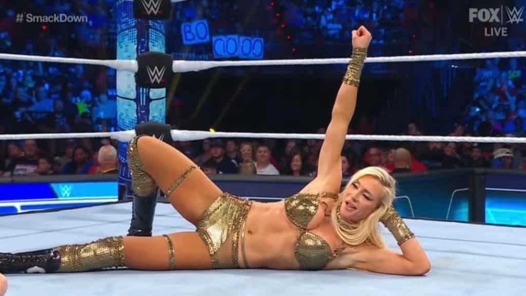 Charlotte Flair posing like Andrade 