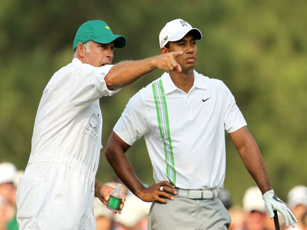 Tiger wood and caddie (Image via golfmagic)