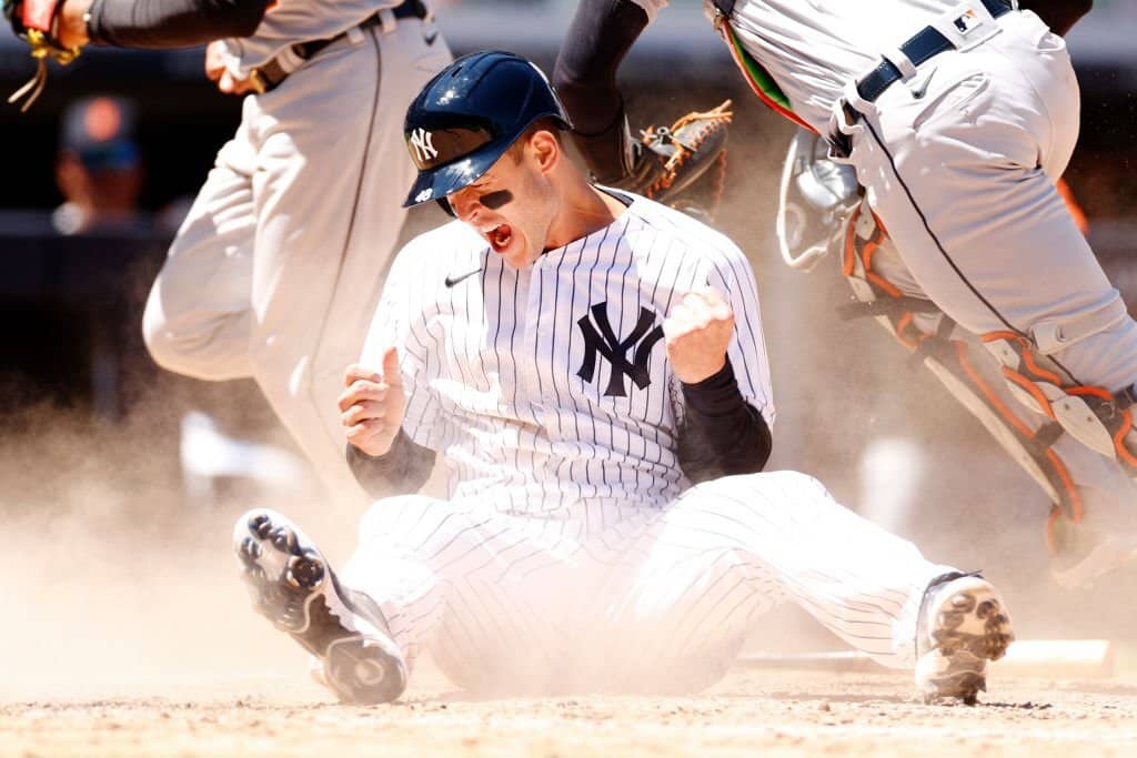 Anthony Rizzo reacting and celebrating after sliding safely