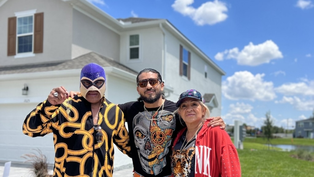 Santos Escobar with his parents 