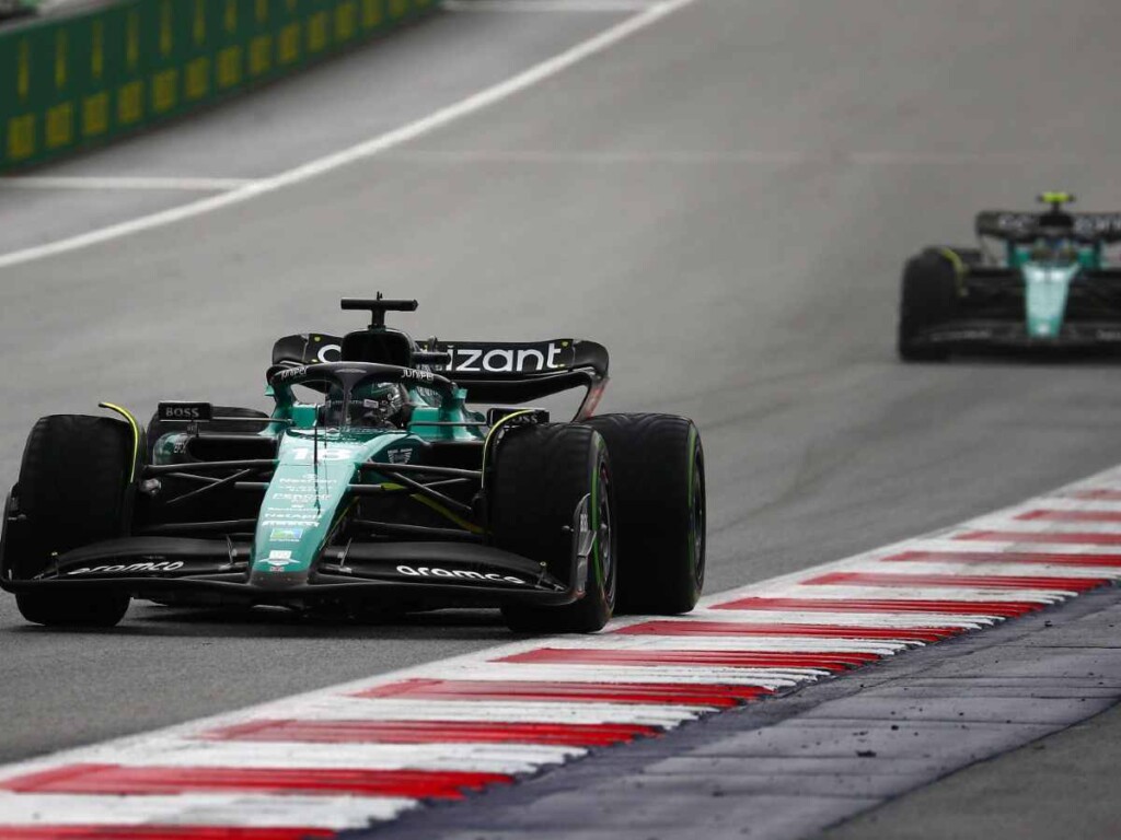 Fernando Alonso and Lance Stroll (behind) at the Austrian GP 