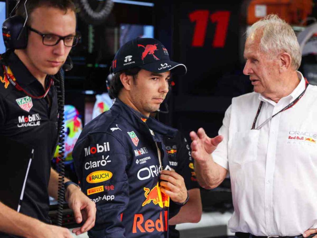 Sergio Perez and Helmut Marko in the Red Bull garage (image via PlanetF1)