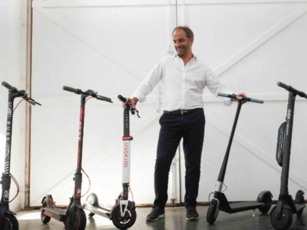 Adam Norris with his Pure Electric scooters