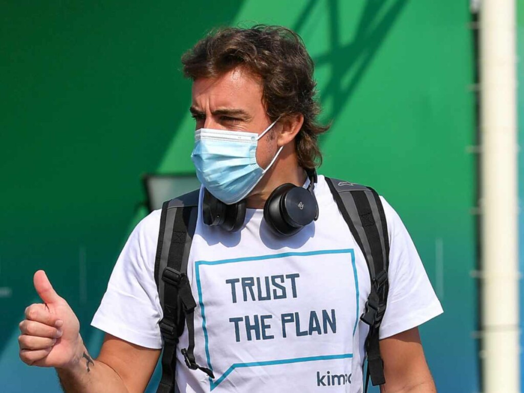 
Fernando Alonso wearing a 'Trust the Plan' t-shirt (image via PlanetF1)