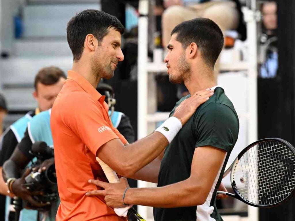 Carlos Alcaraz and Novak Djokovic during the Madrid Open last year